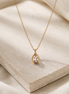 Aurora Teardrop Necklace with crystal accents in gold tone