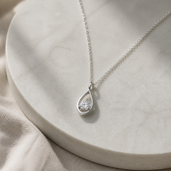 Aurora Teardrop Necklace with crystal accents in silver tone