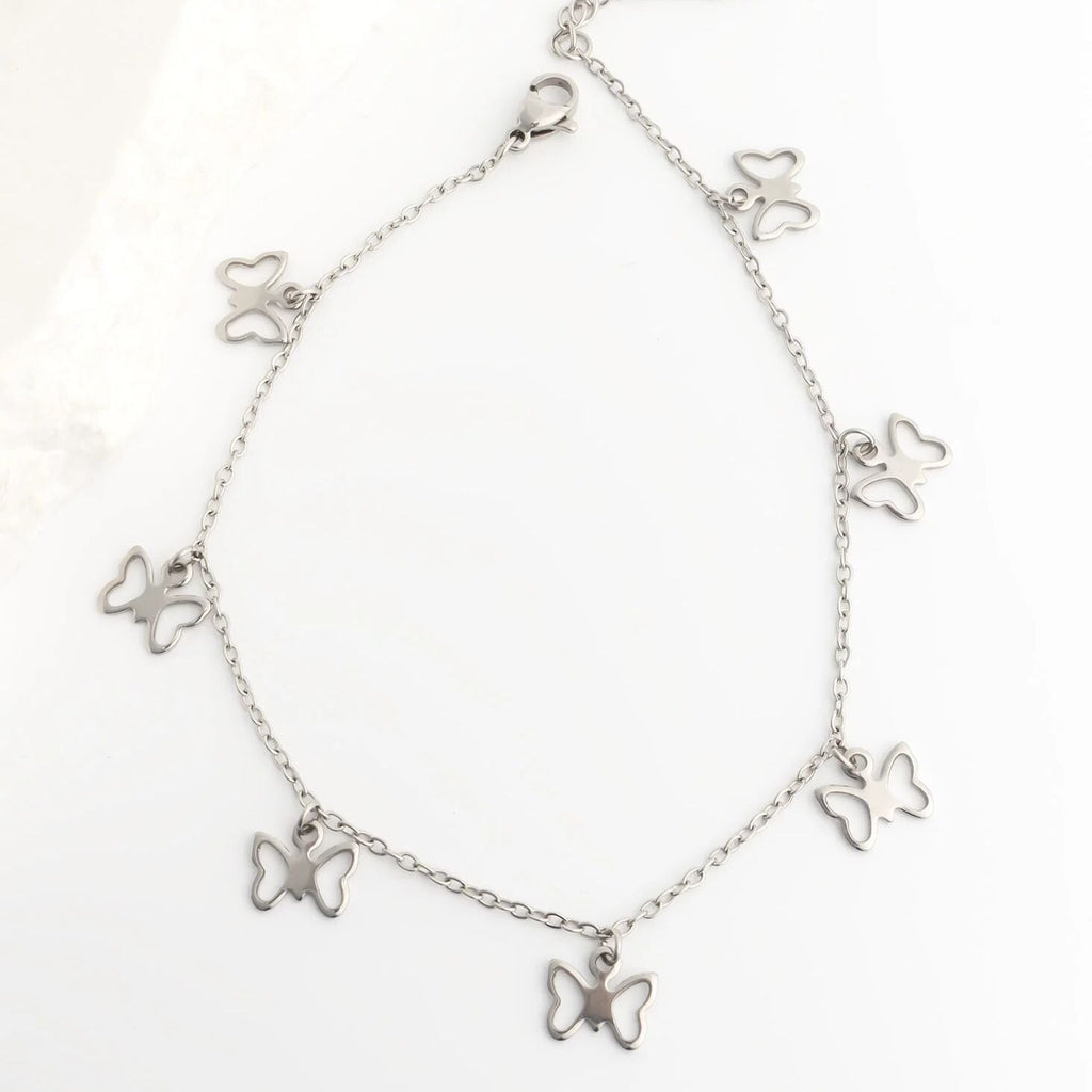 Silver butterfly bracelet on a white background