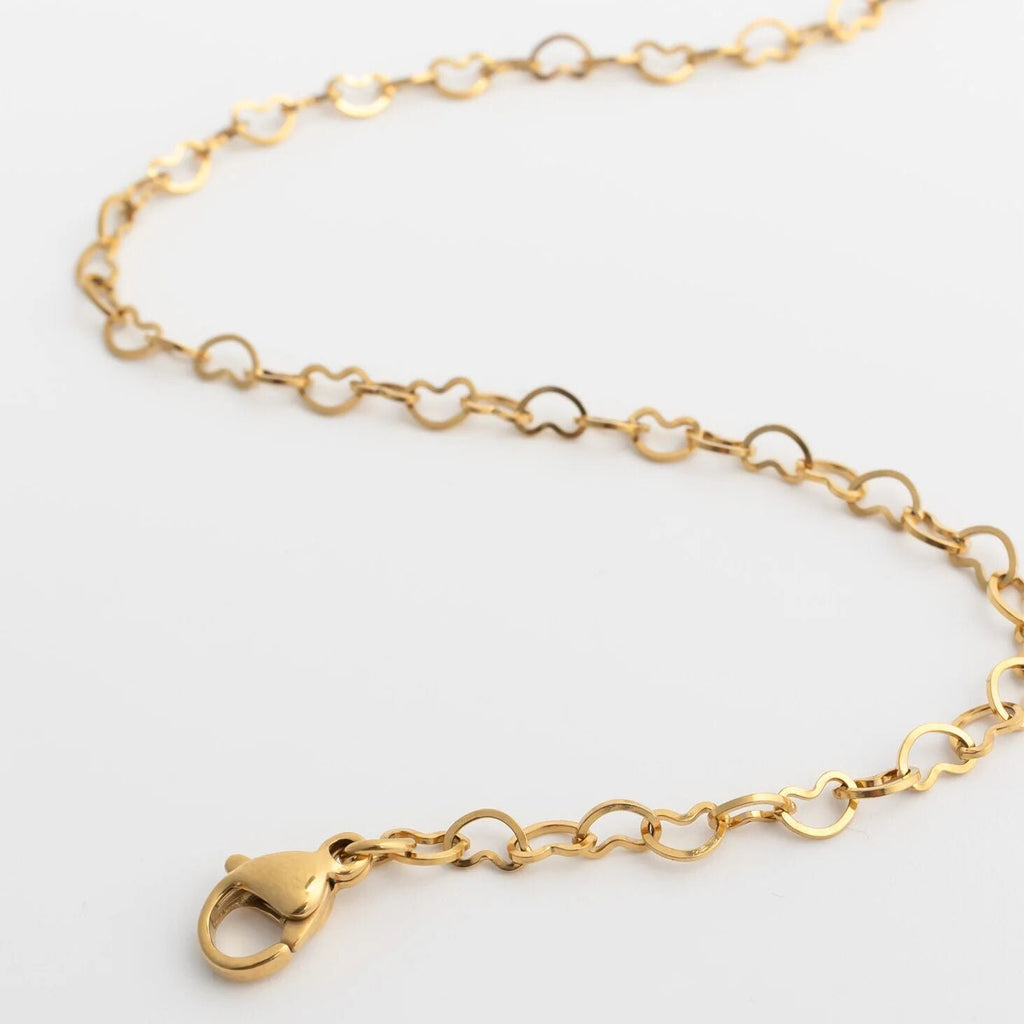 Gold chain Linked Hearts Anklet on a light gray background