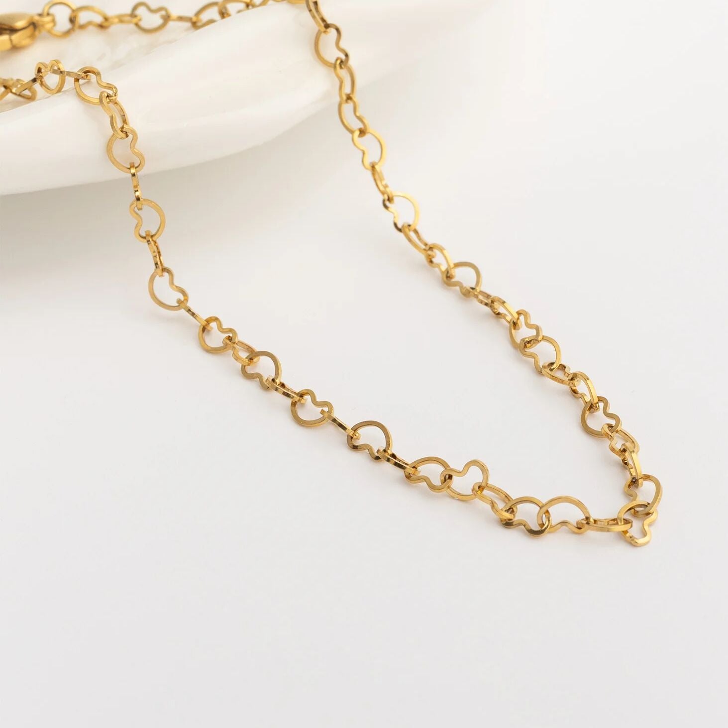 Gold chain Linked Hearts Anklet on a white background