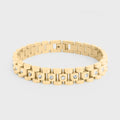 Gold bracelet with embedded diamonds on a light gray background