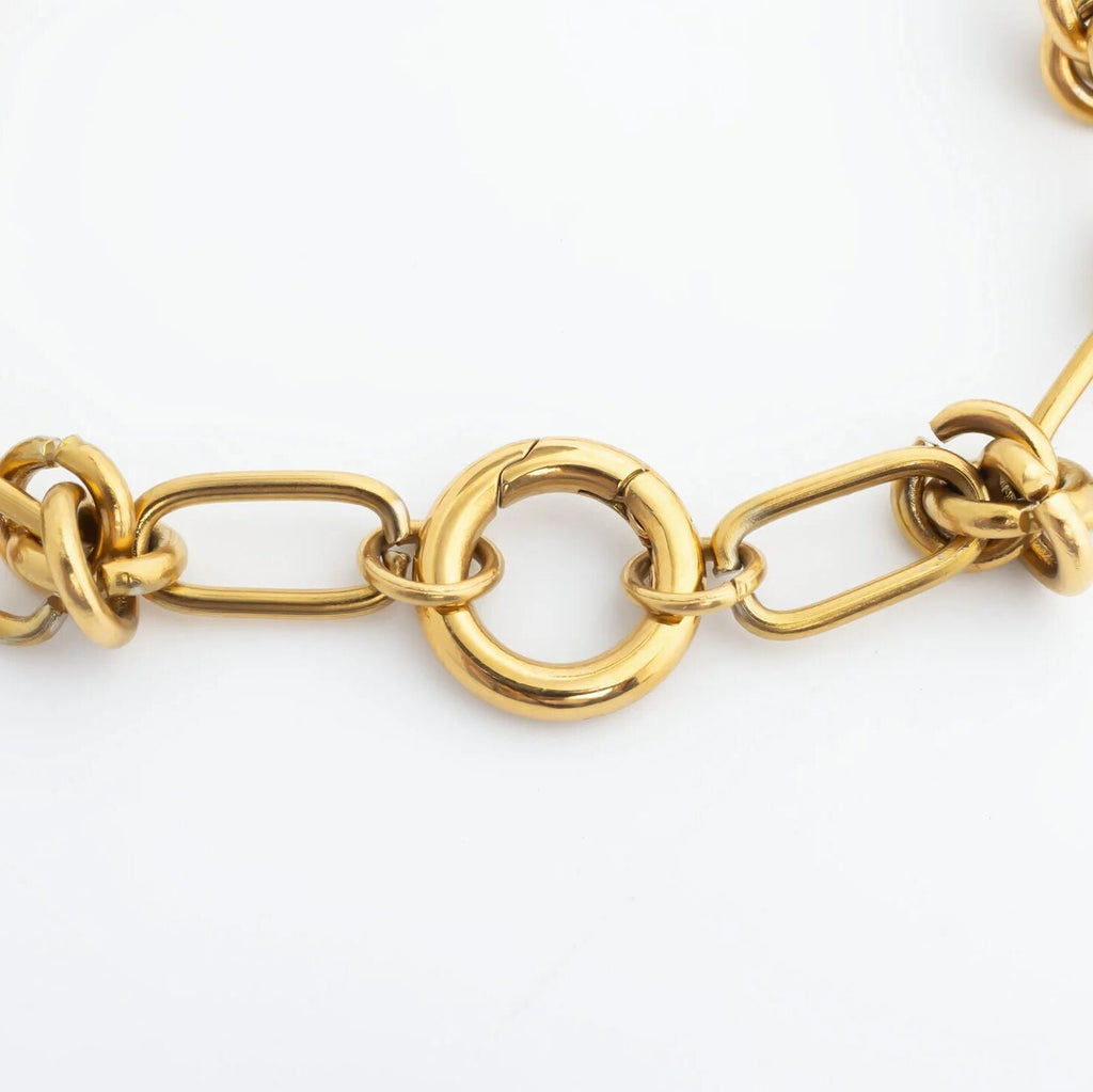 Gold chain bracelet on a white background