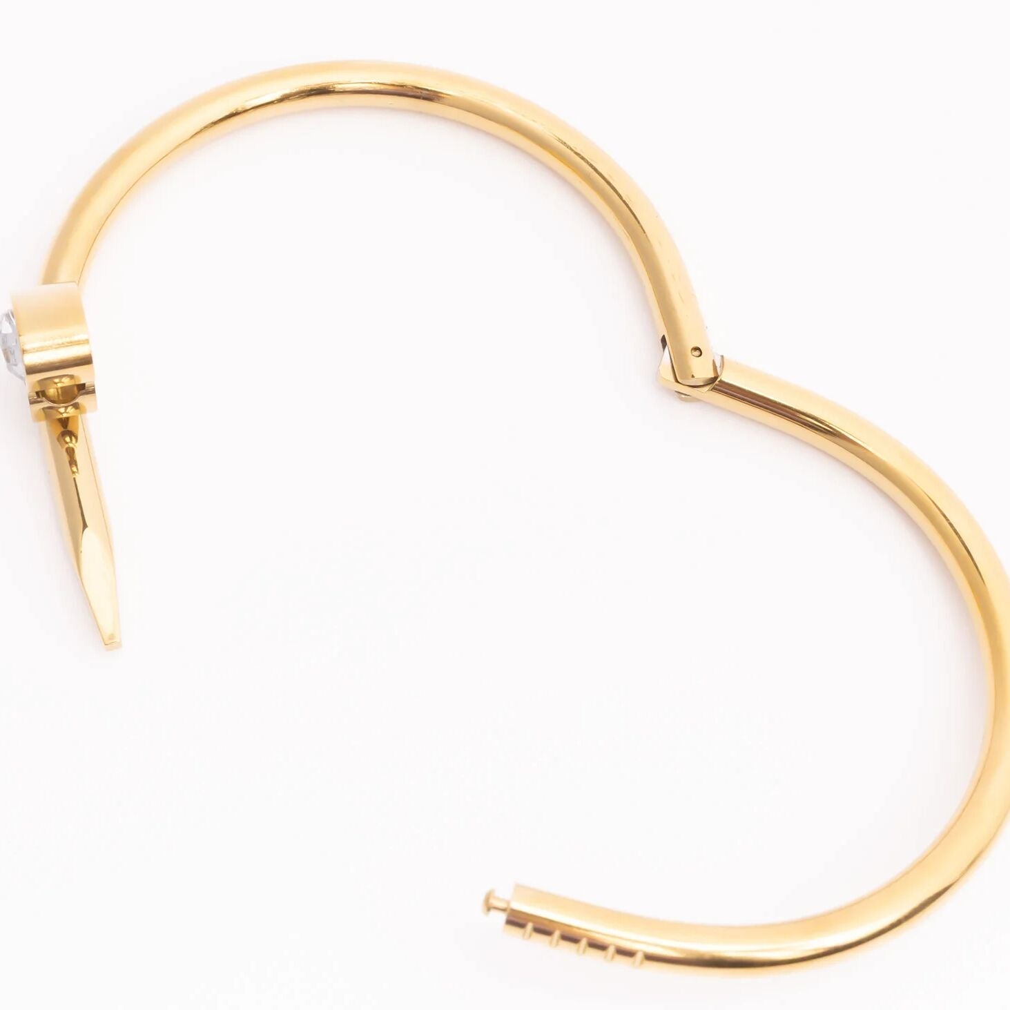 Gold hoop earring on a white background
