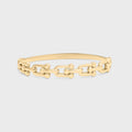 Gold chain bracelet on a light gray background