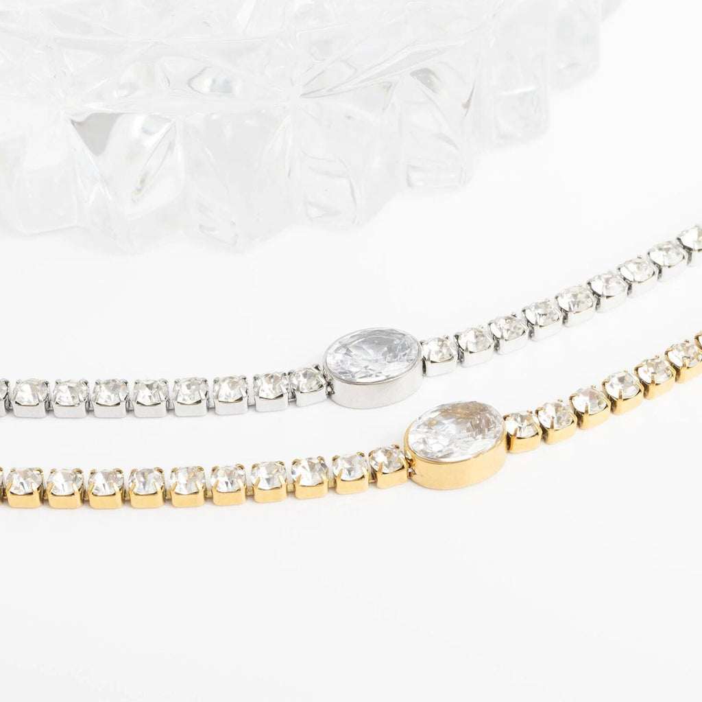 Two diamond bracelets on a white background