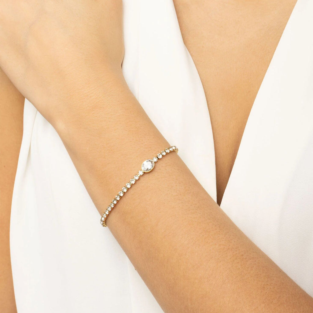 Pearl bracelet on a person's wrist against a white background