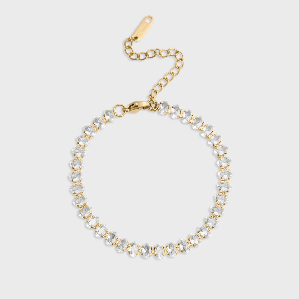 Gold and silver beaded bracelet on a light gray background