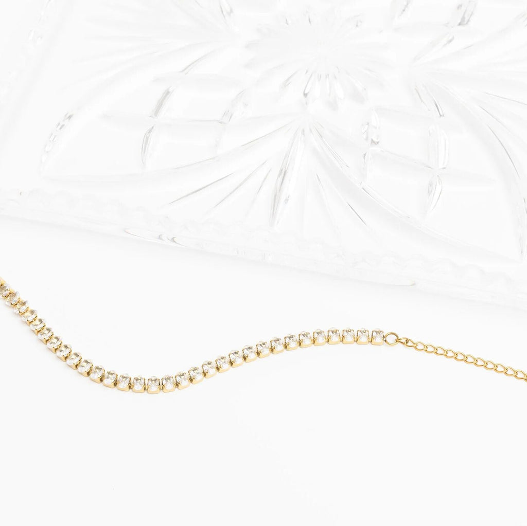 Gold chain necklace on a white background