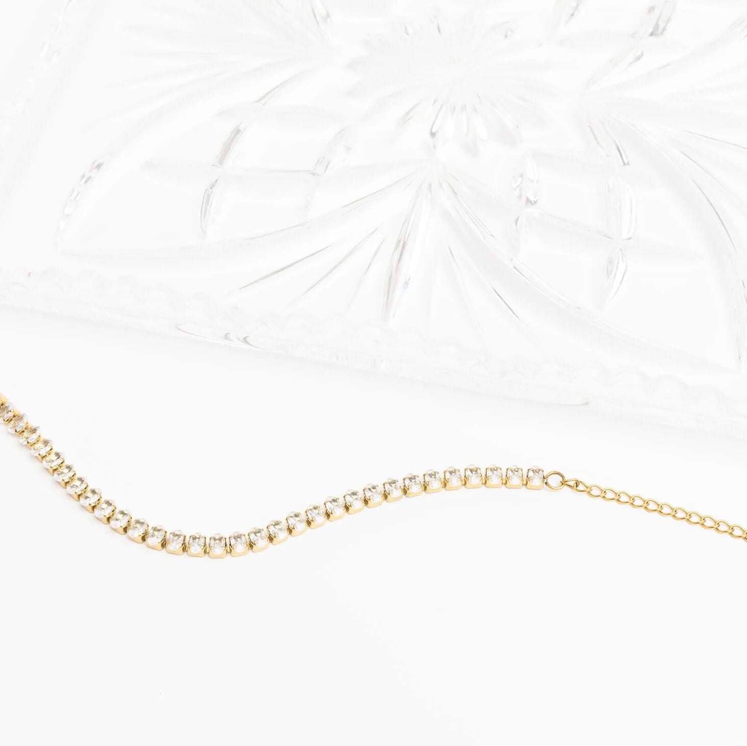 Gold chain necklace on a white background