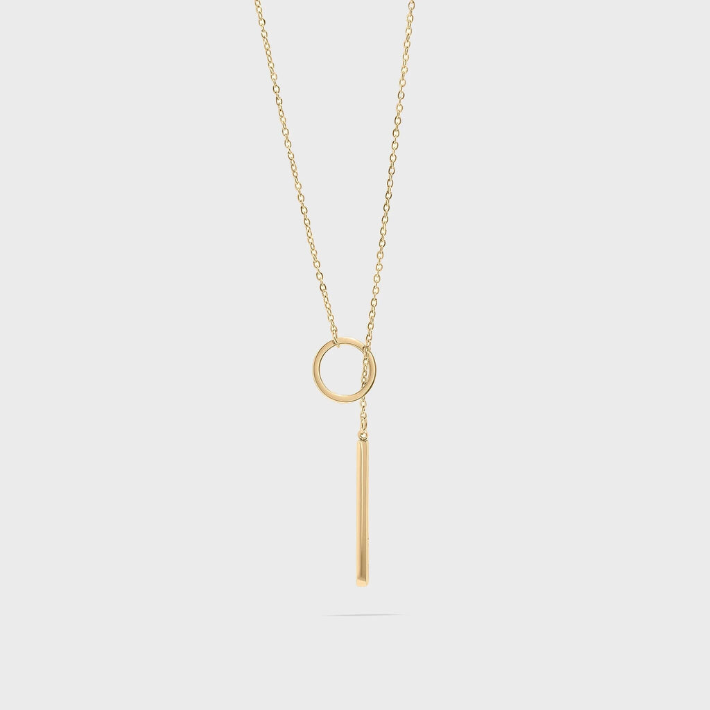 Gold necklace with circular lariat pendant on a white background