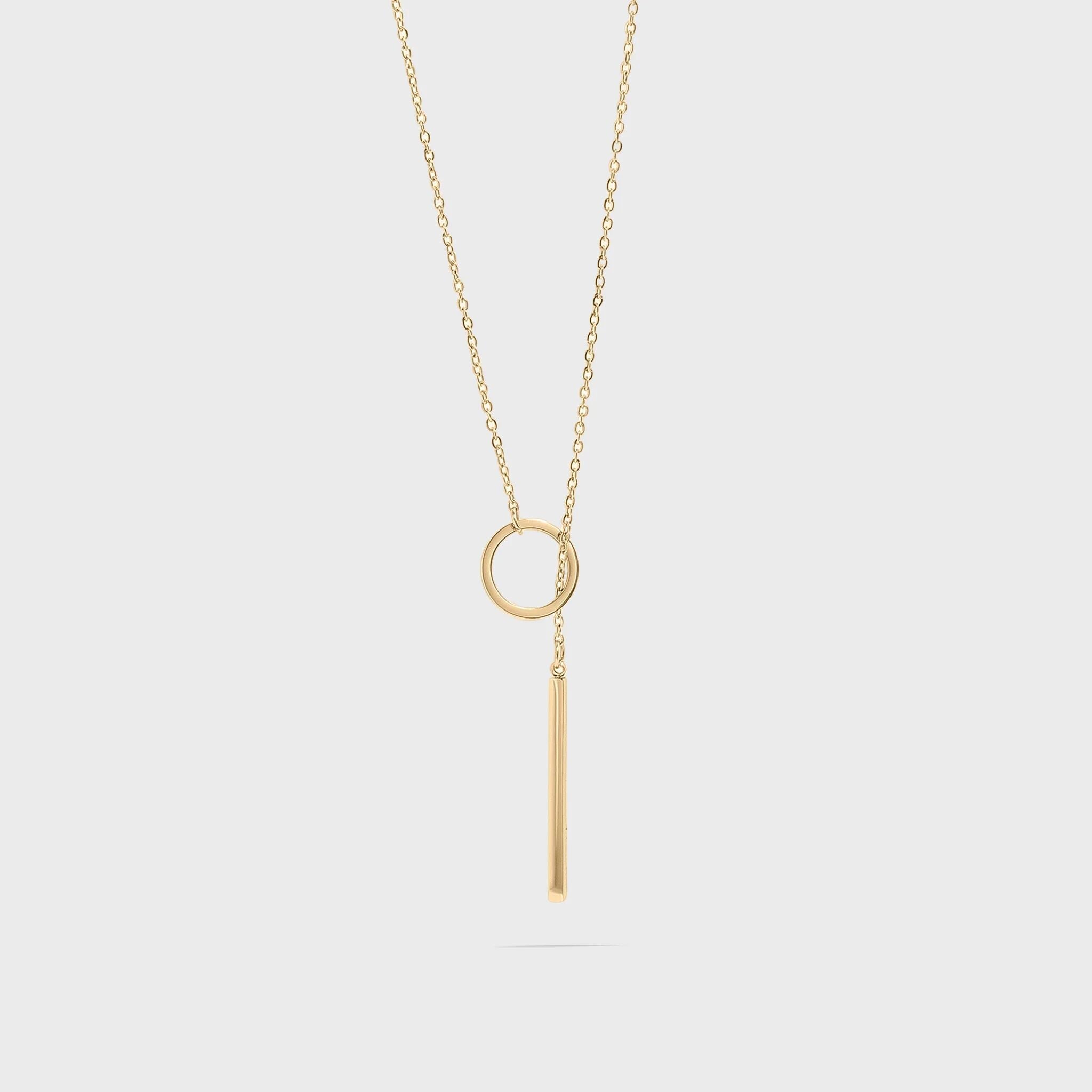 Gold necklace with circular lariat pendant on a white background