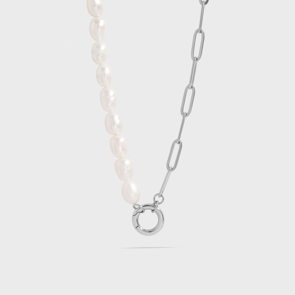 The Destin Necklace displayed on a white background, featuring a split chain design with freshwater pearls and Stainless Steel paperclip links, joined by a round charm holder clasp