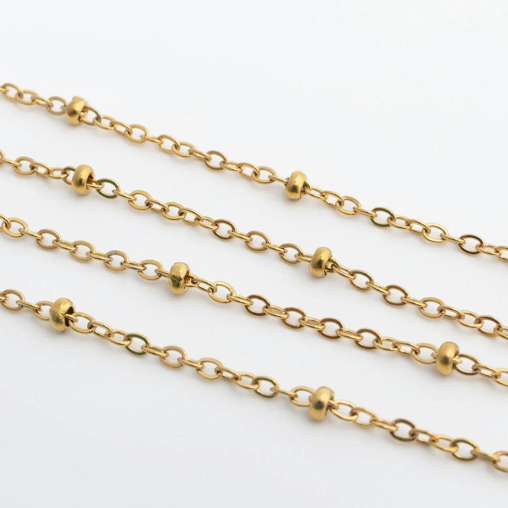 Gold Satellite Belly Chain on a white background