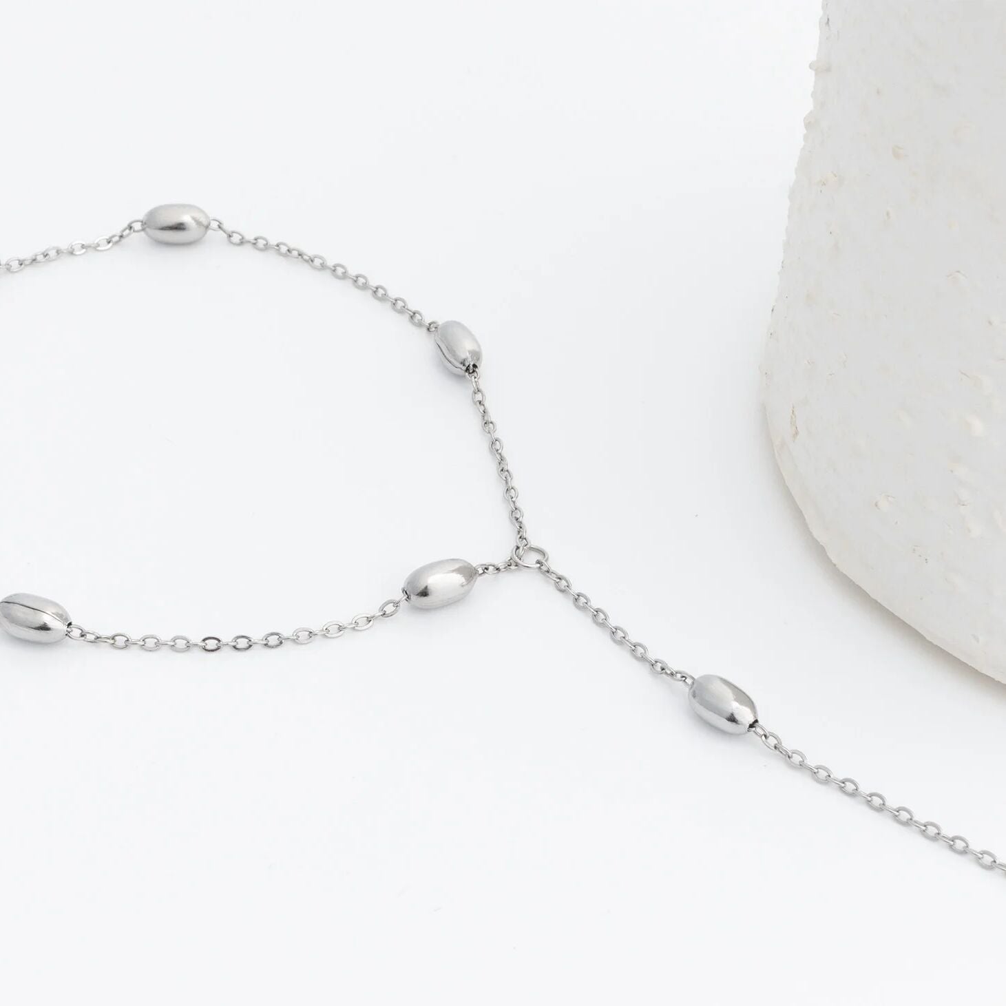Silver Statement Bead Hand Chain on a white background