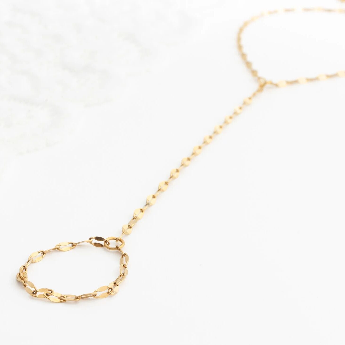 Gold Lip Hand Chain on a white background