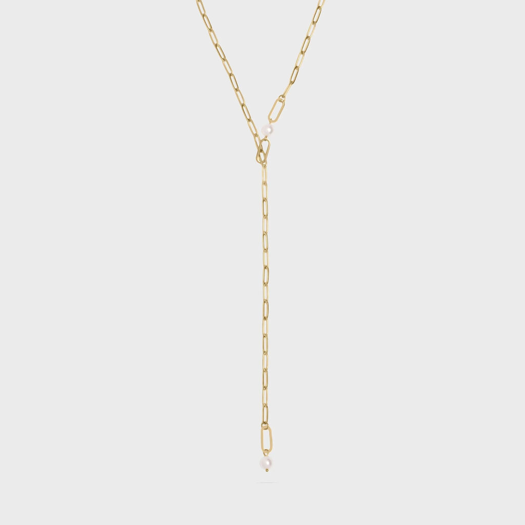 Gold y-shaped chain necklace on a light gray background