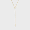 Gold y-shaped chain necklace on a light gray background