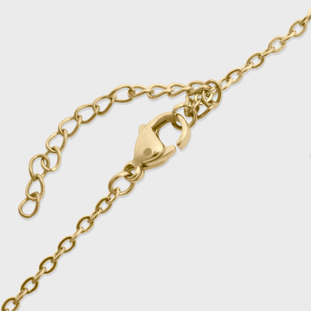 Gold chain bracelet with lobster clasp on a white background