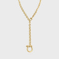 Gold necklace with a clasp on a light gray background