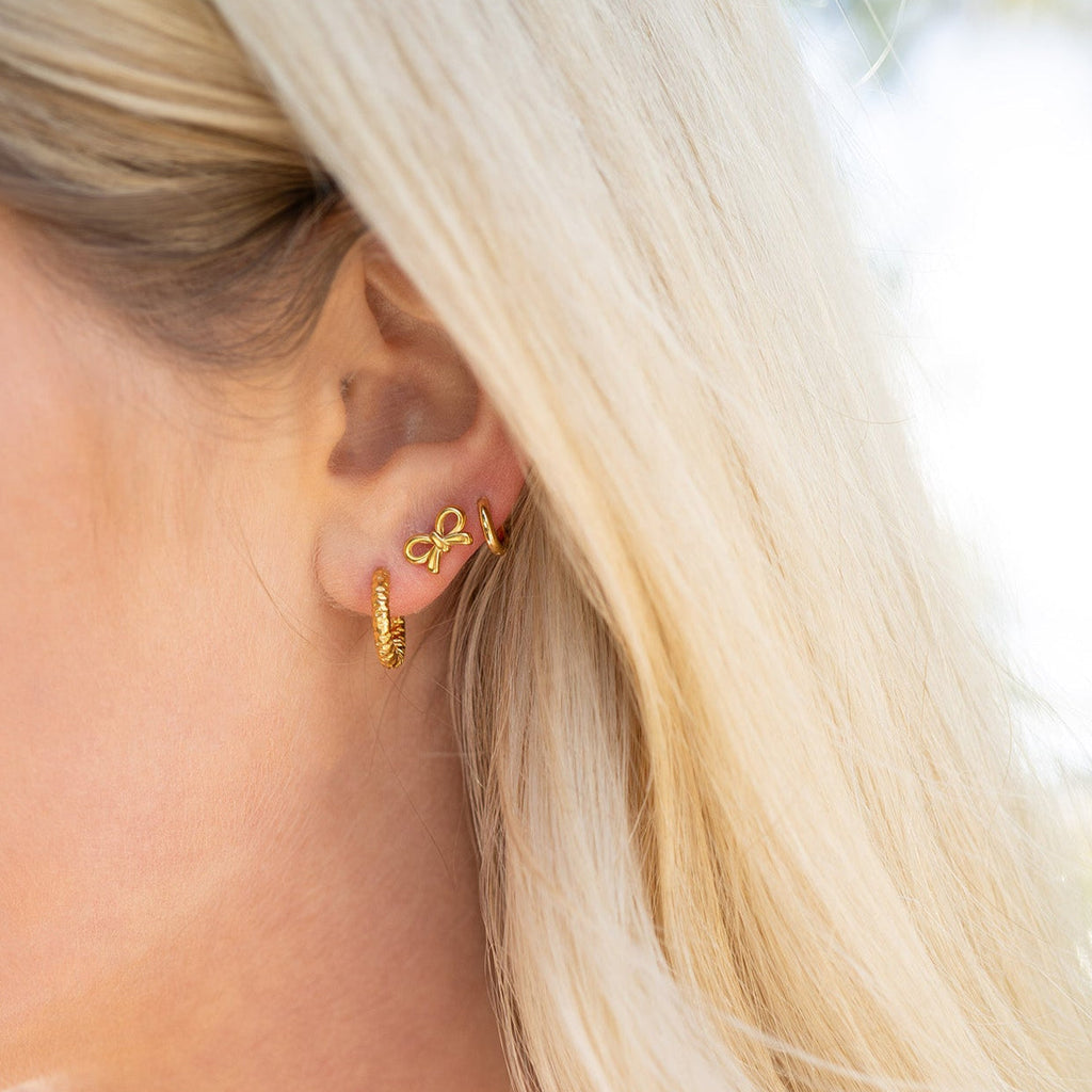Gold bow stud earrings