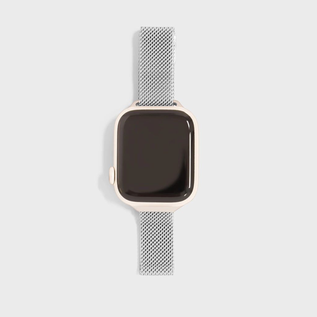 Smartwatch with a silver mesh band on a light gray background