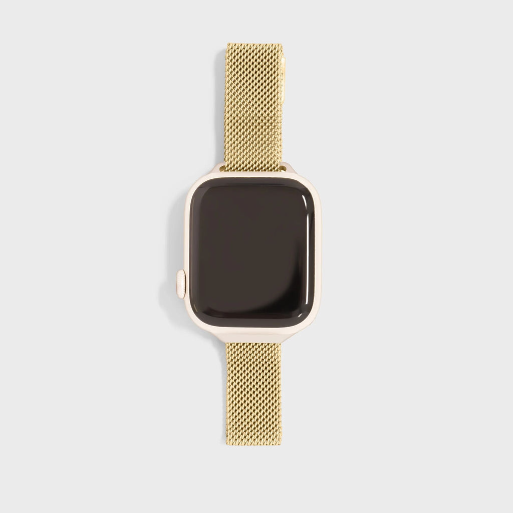 Gold smartwatch with mesh band on a light gray background