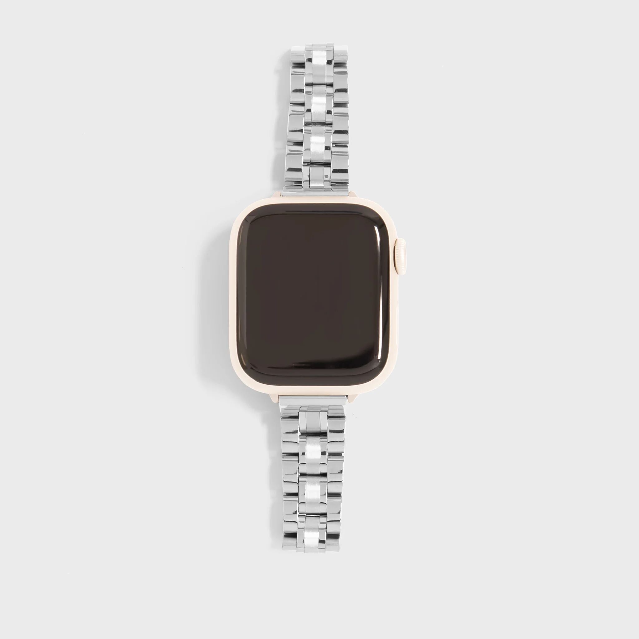 Smartwatch with a silver metal band on a light gray background