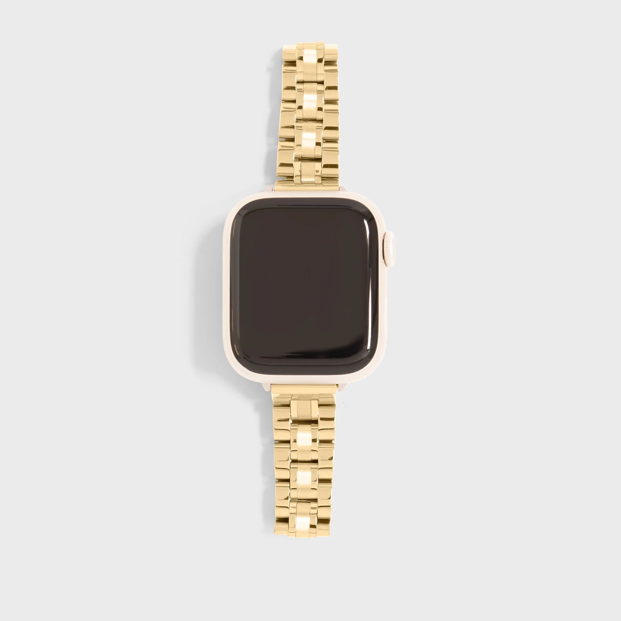 Gold smartwatch on a light gray background