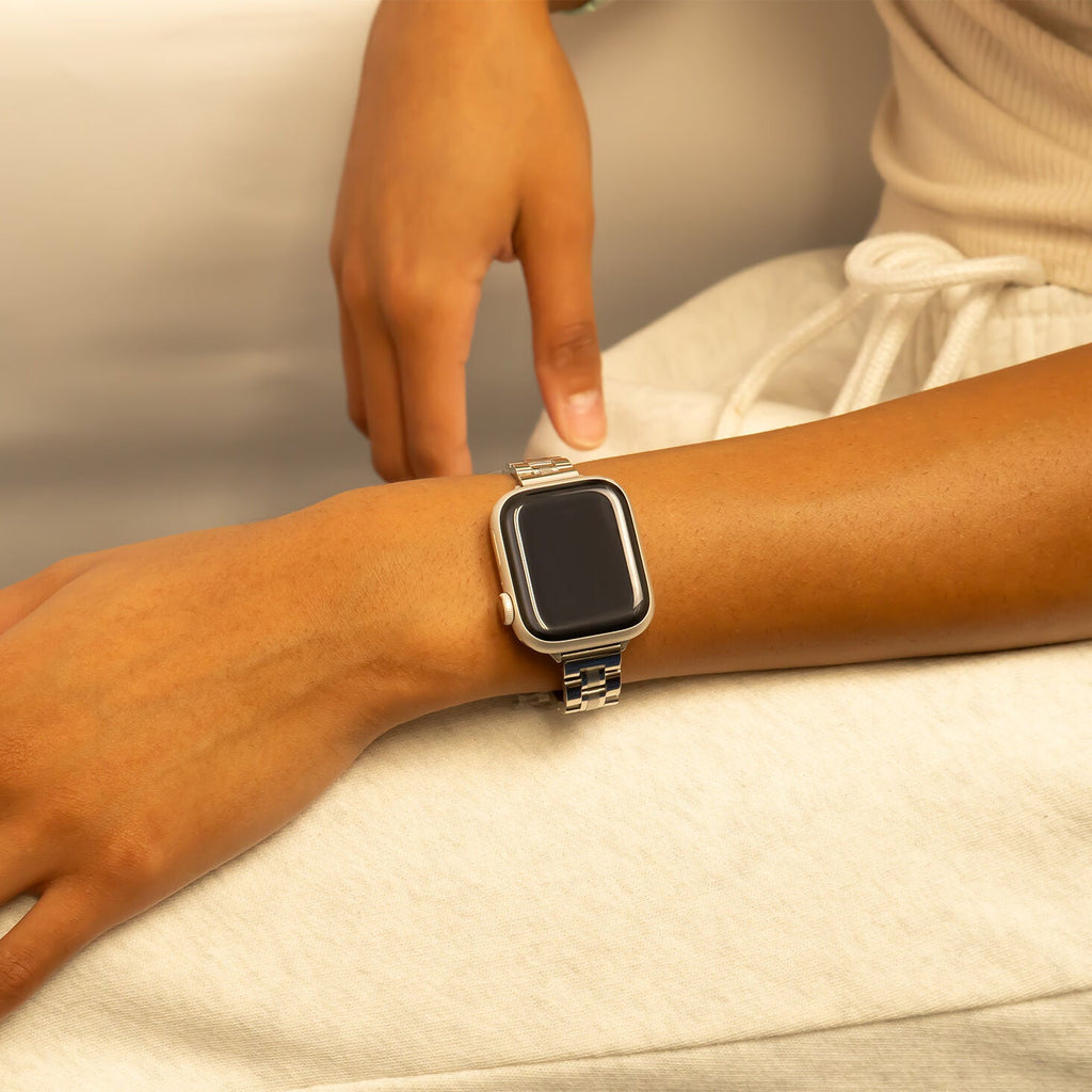 Smartwatch on a wrist with a neutral background