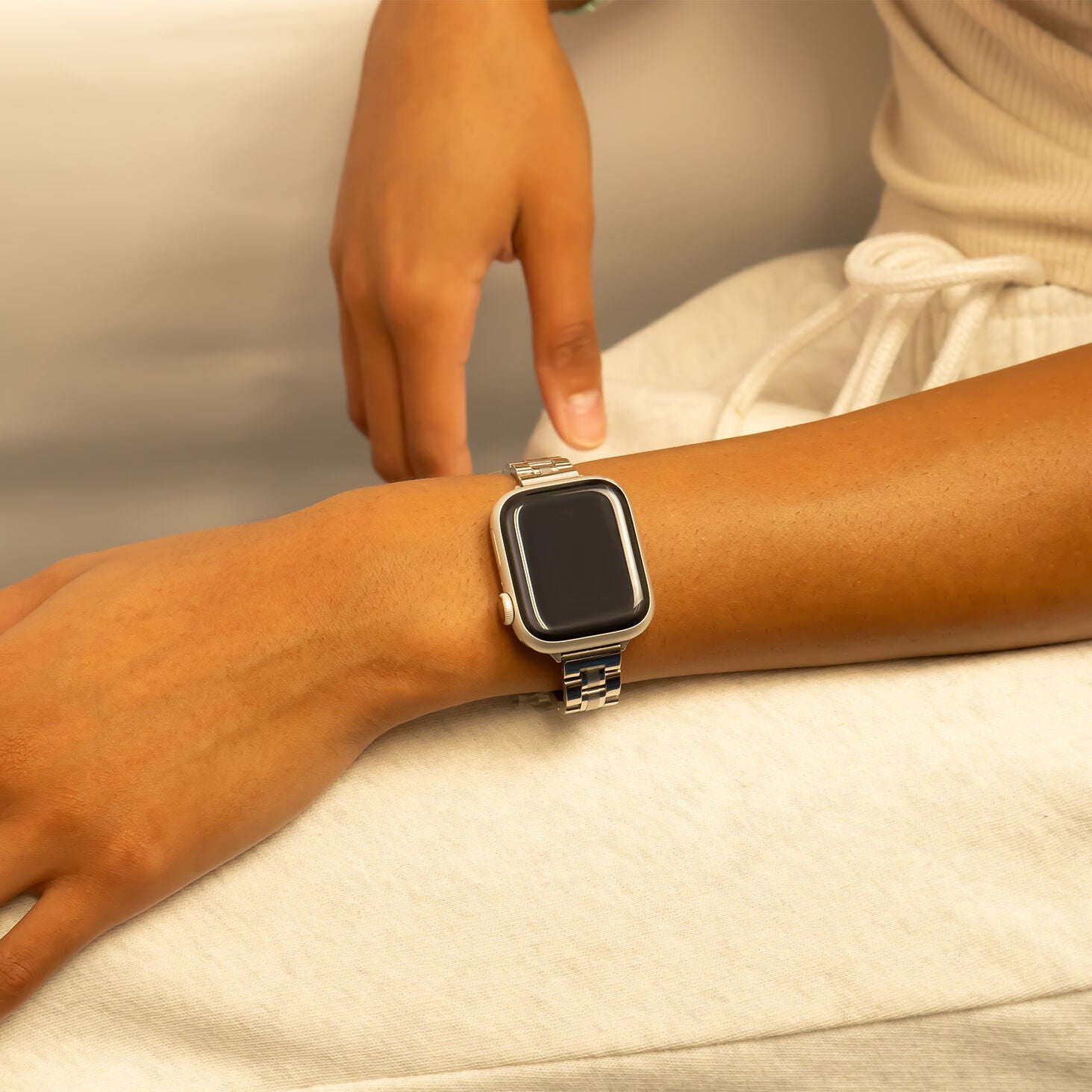 Smartwatch on a wrist with a neutral background