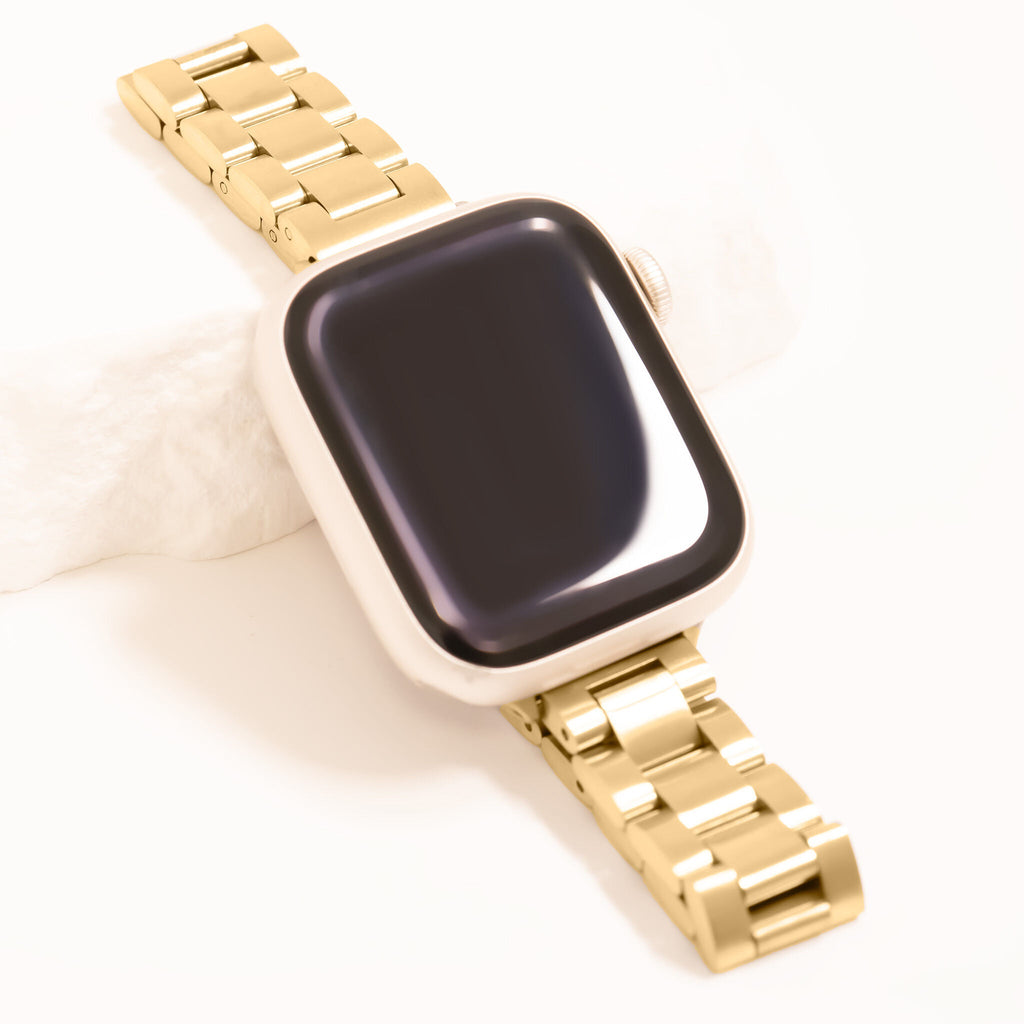 Smartwatch with a gold metal band on a white background