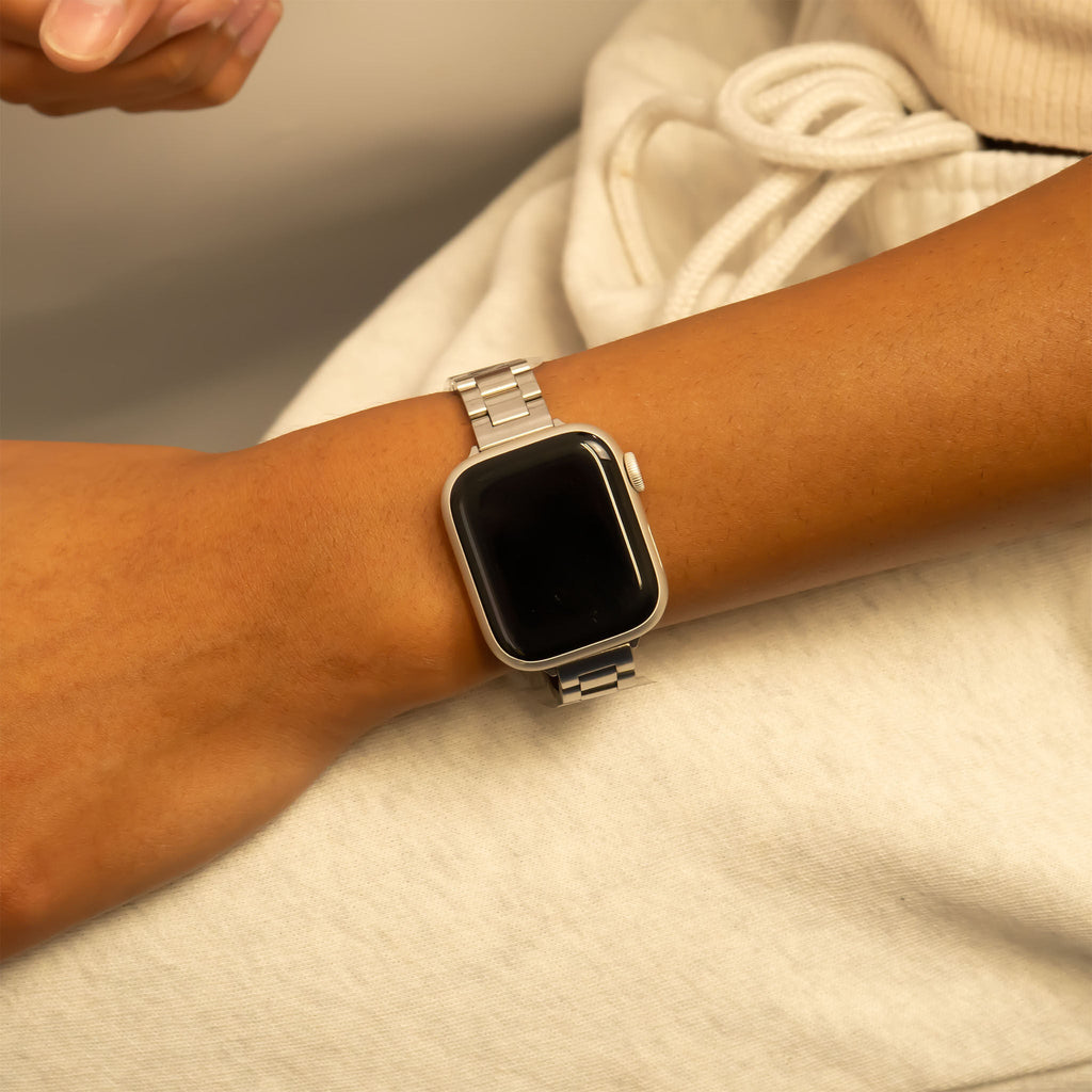 Smartwatch on a wrist with a neutral background