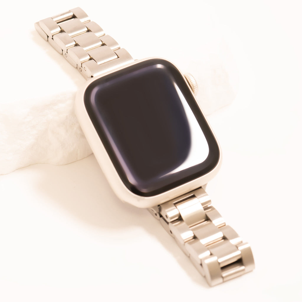 Smartwatch with a gold metal band on a white background