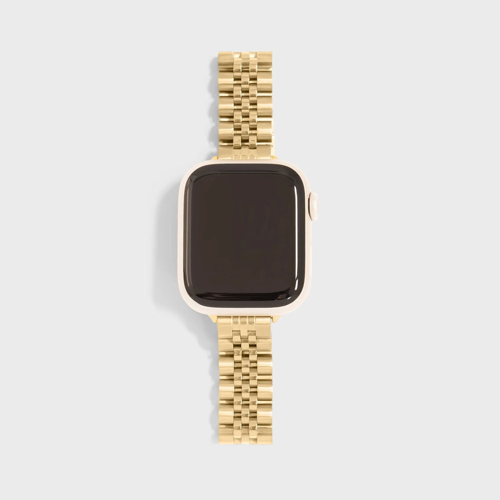 Smartwatch with a gold metal band on a light gray background