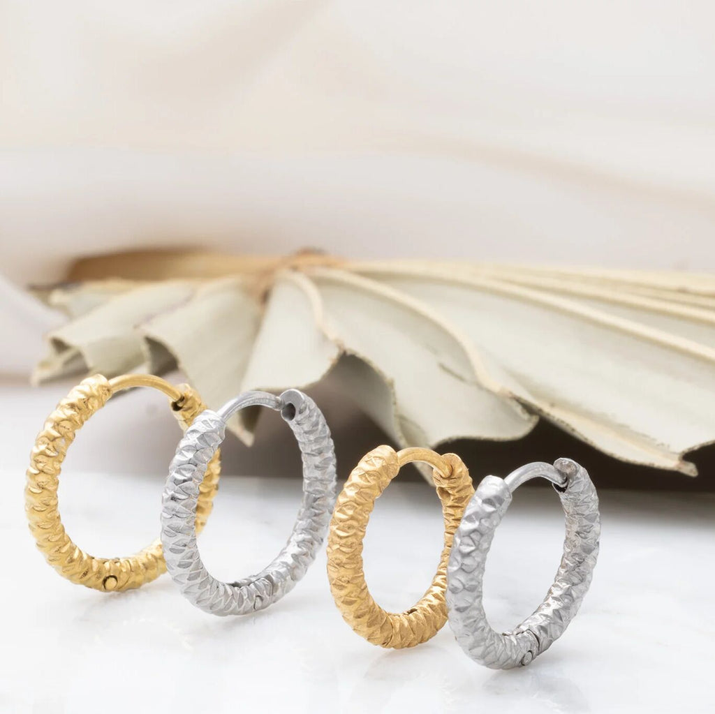 Textured Huggie Hoop Earrings-gold and silver studio scale shot 