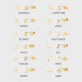 Set of gold earrings corresponding to each zodiac sign on a light gray background