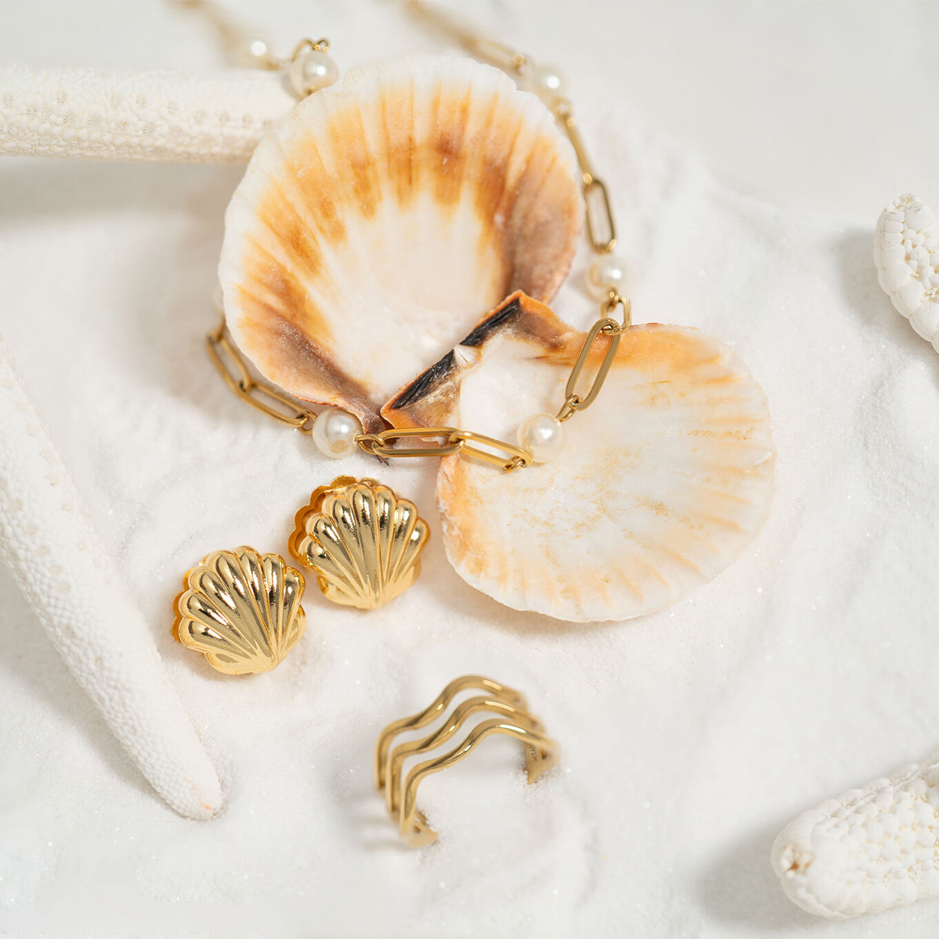 Shell Huggie Earrings- gold studio collection shot