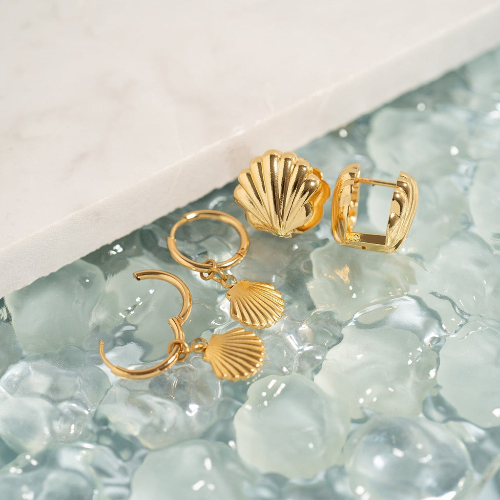 Shell Huggie Earrings- gold collection studio shot
