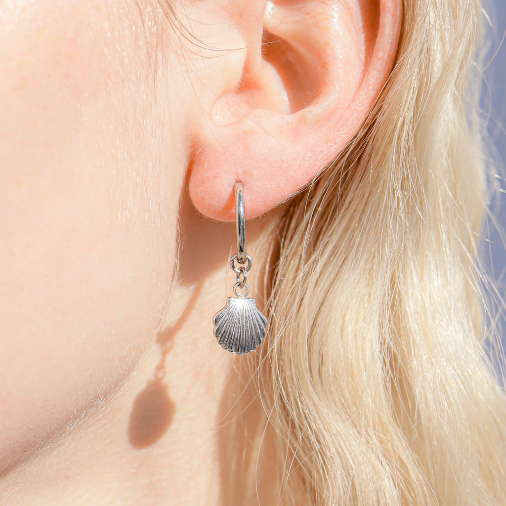 shell charm huggie earrings