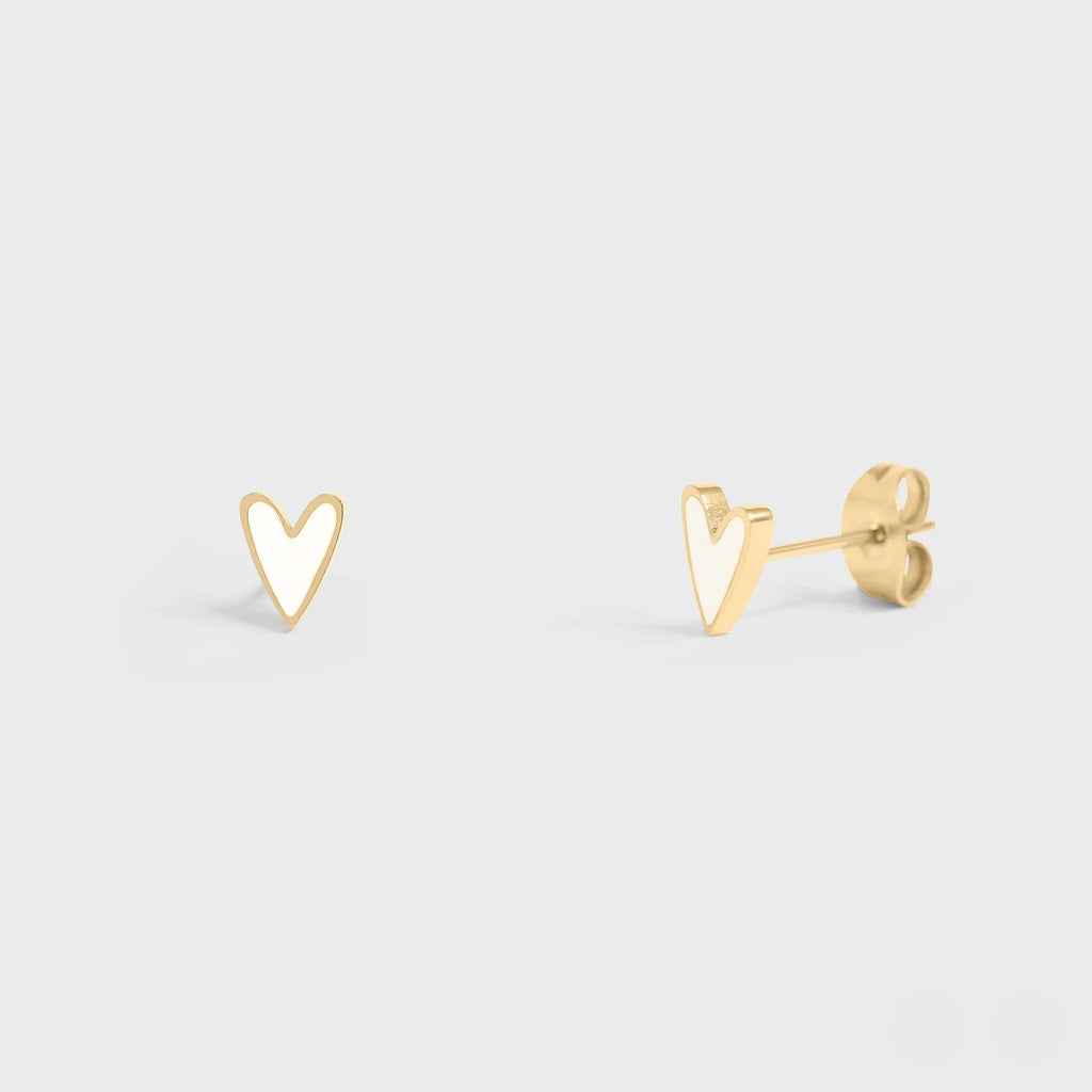 Gold heart-shaped earrings on a light gray background
