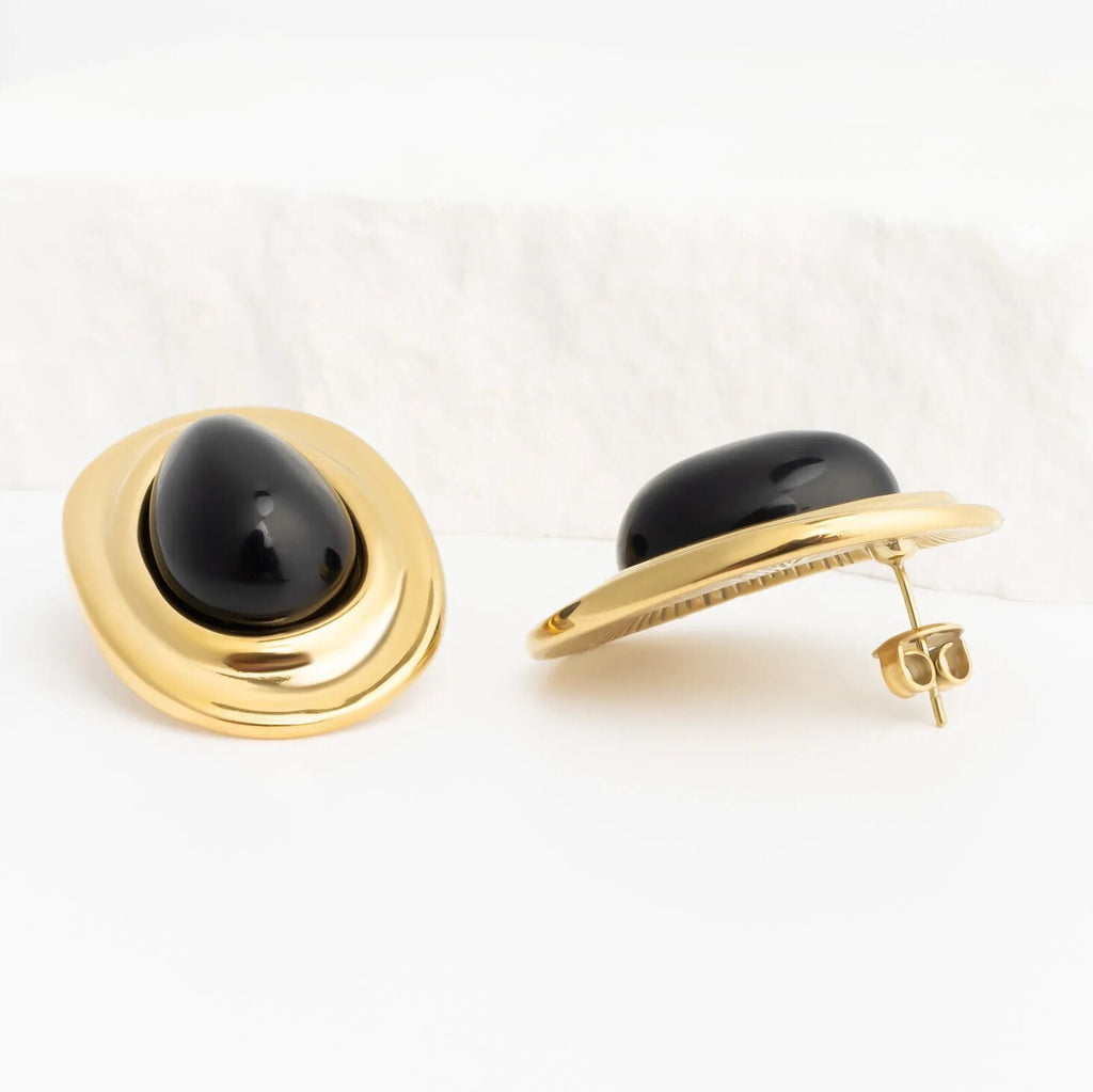 Gold Black Enamel Stud Earrings with black gemstone on a white background