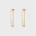 Gold hoop earrings with clear gemstones on a light gray background