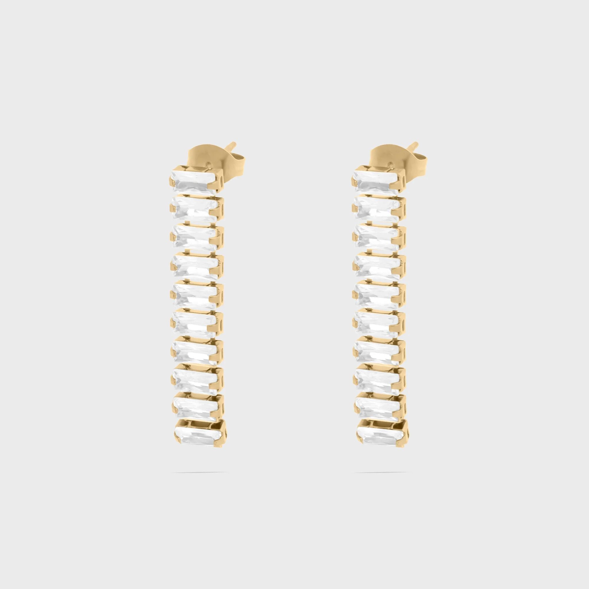 Gold hoop earrings with clear gemstones on a light gray background