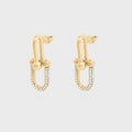 Gold hoop earrings with small beads on a light gray background