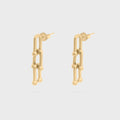 Gold chain-link earrings on a light gray background