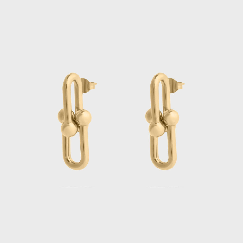 Pair of silver hoop earrings with embedded stones on a white background