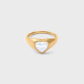 Gold ring with a heart-shaped MOP on a light gray background