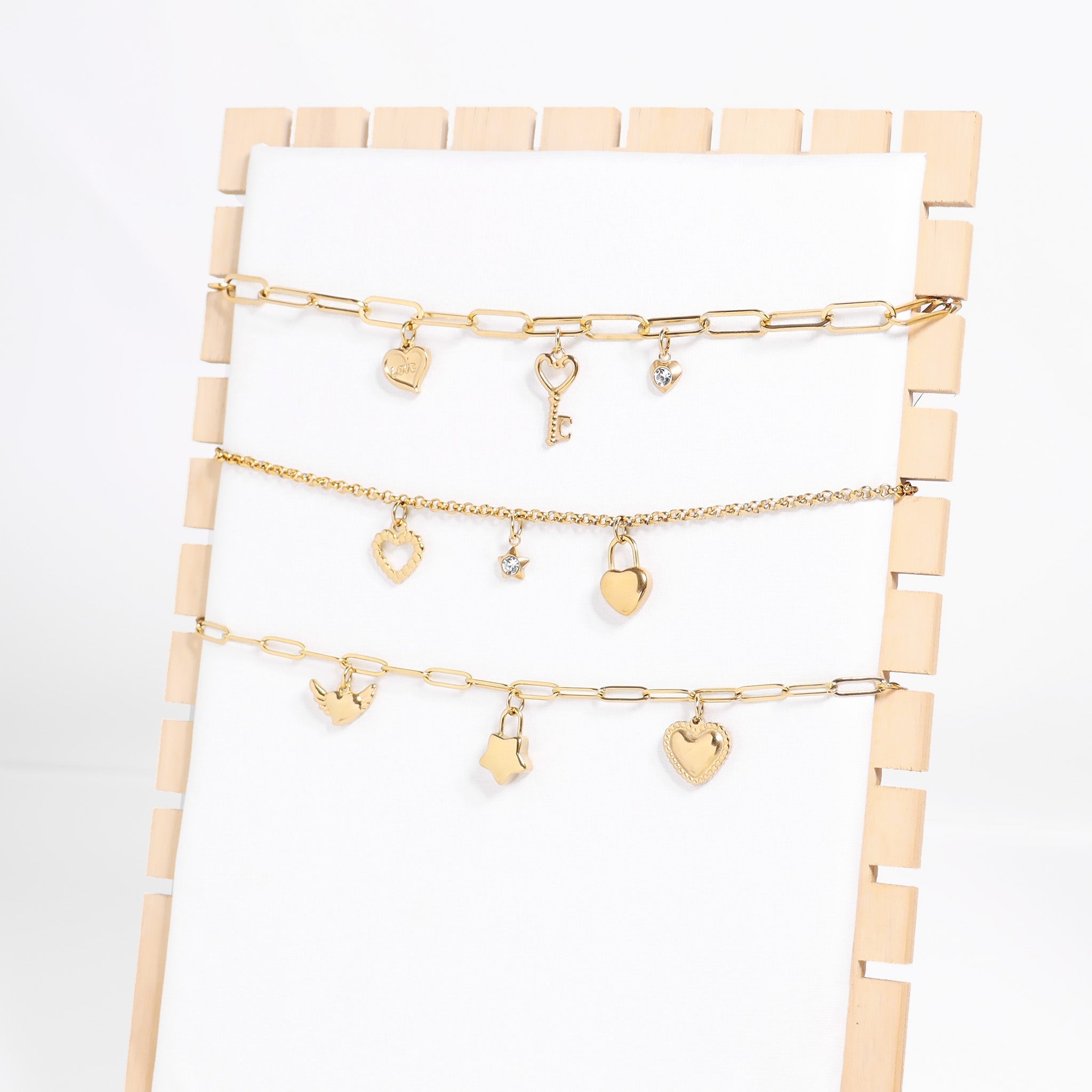 Heart With Cubic Zirconia Charm with other charms and chains on display