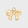 Gold bow-shaped pendant on a light gray background